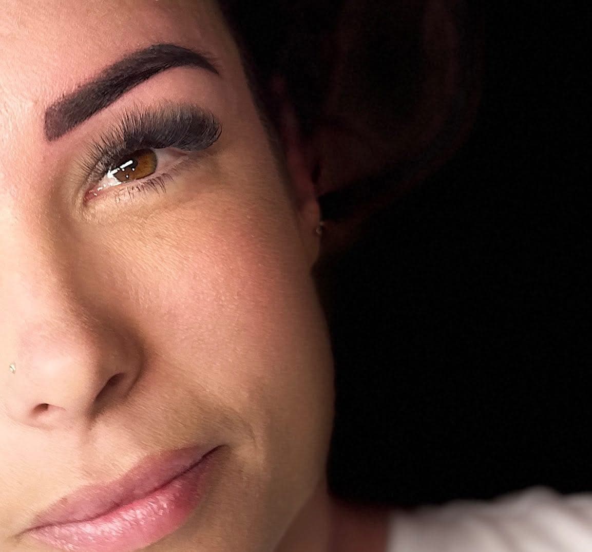 Close-up of a dark, defined eyebrow and its tapered tail