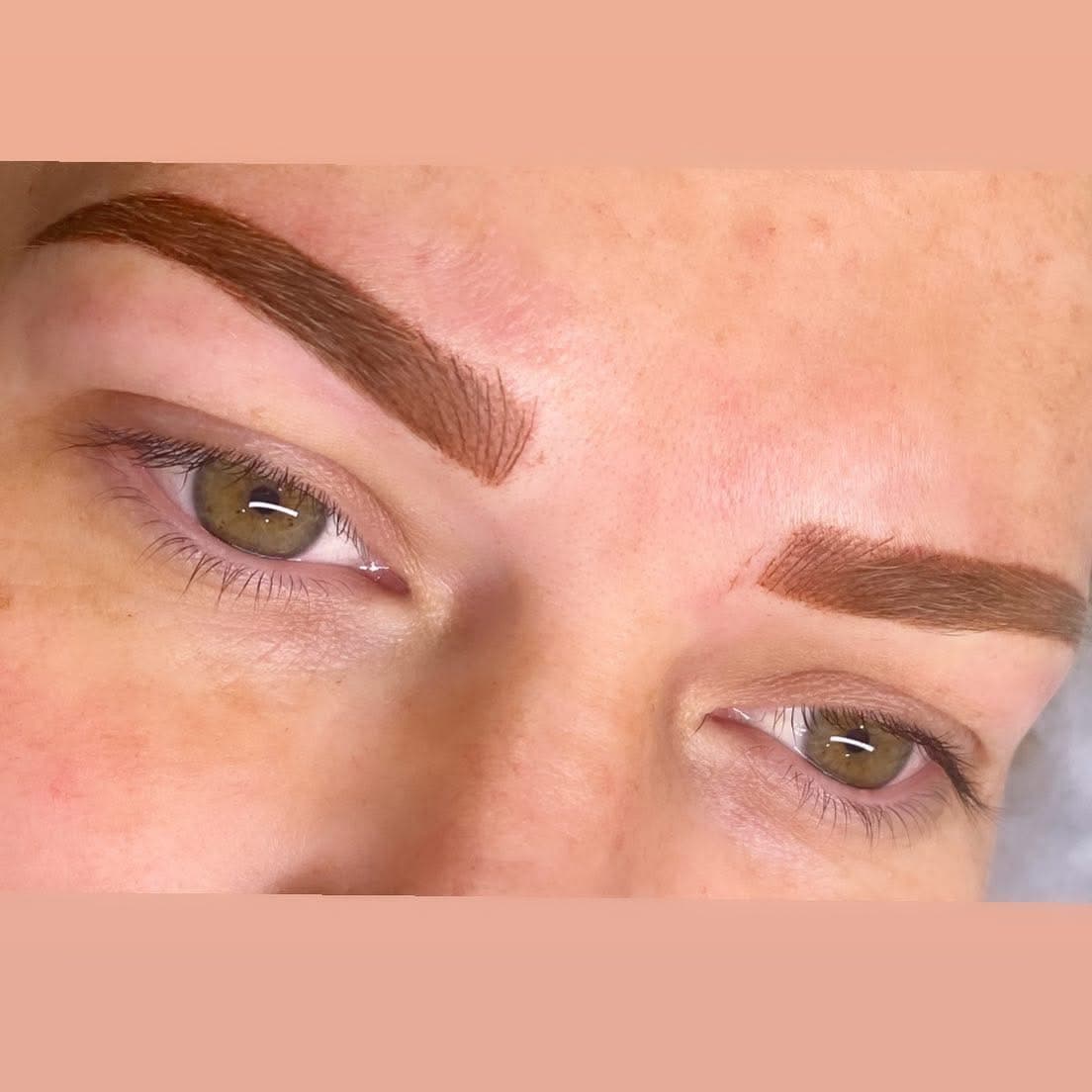 Fine hair-like detailing through a pair of brown eyebrows