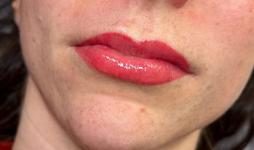 Close-up of vivid rose lip colour and a defined lip outline